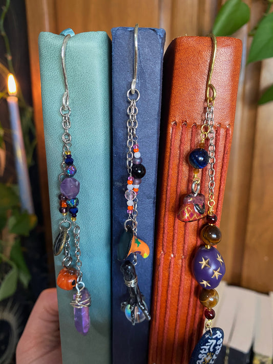 three books with beaded dangly bookmark