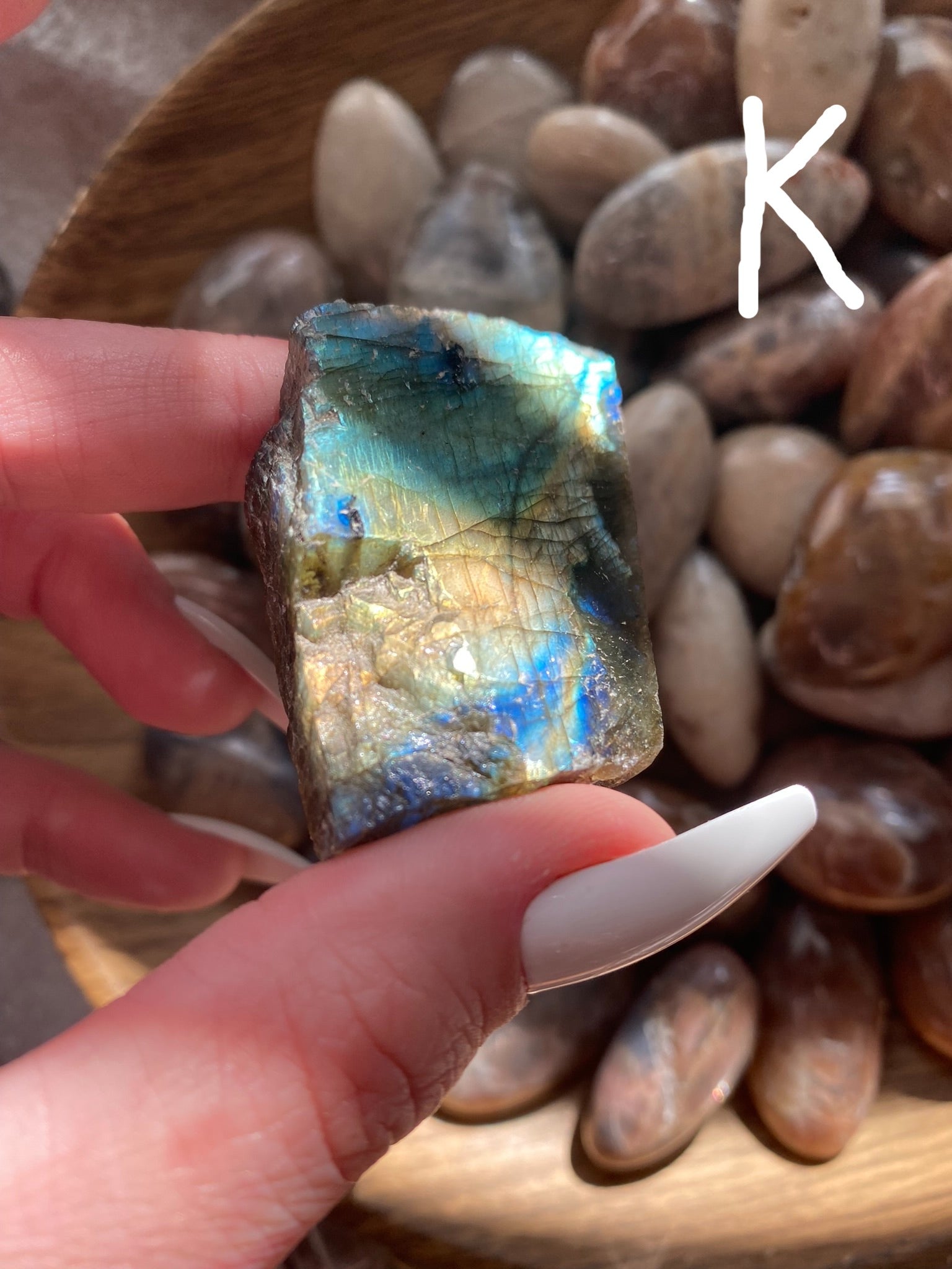 labradorite with bright orange, green, and blue flash