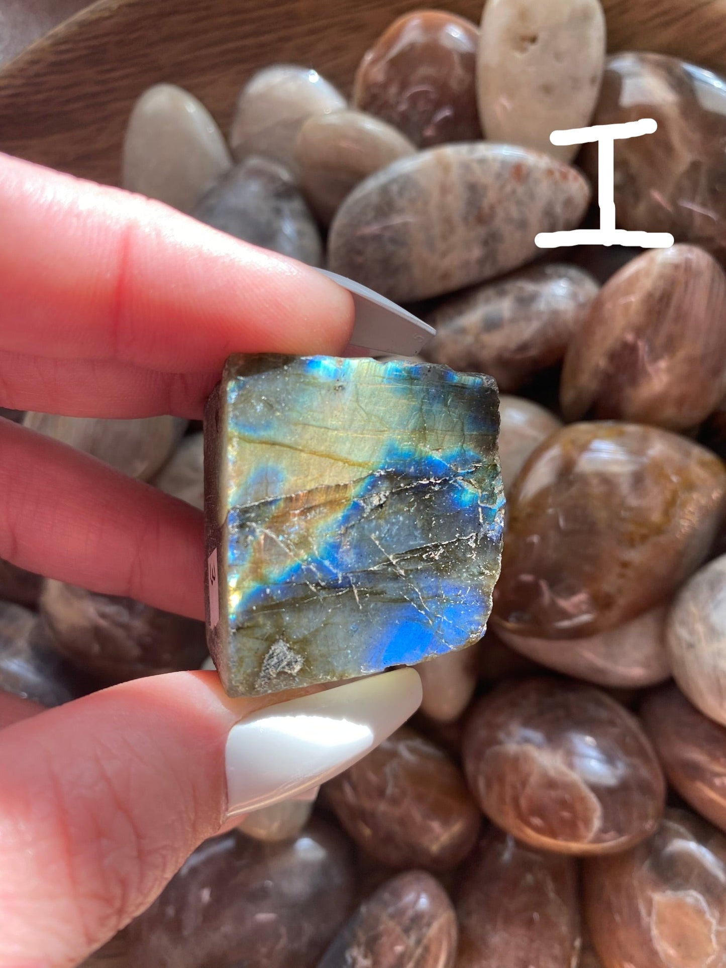 small labradorite with orange and blue flash