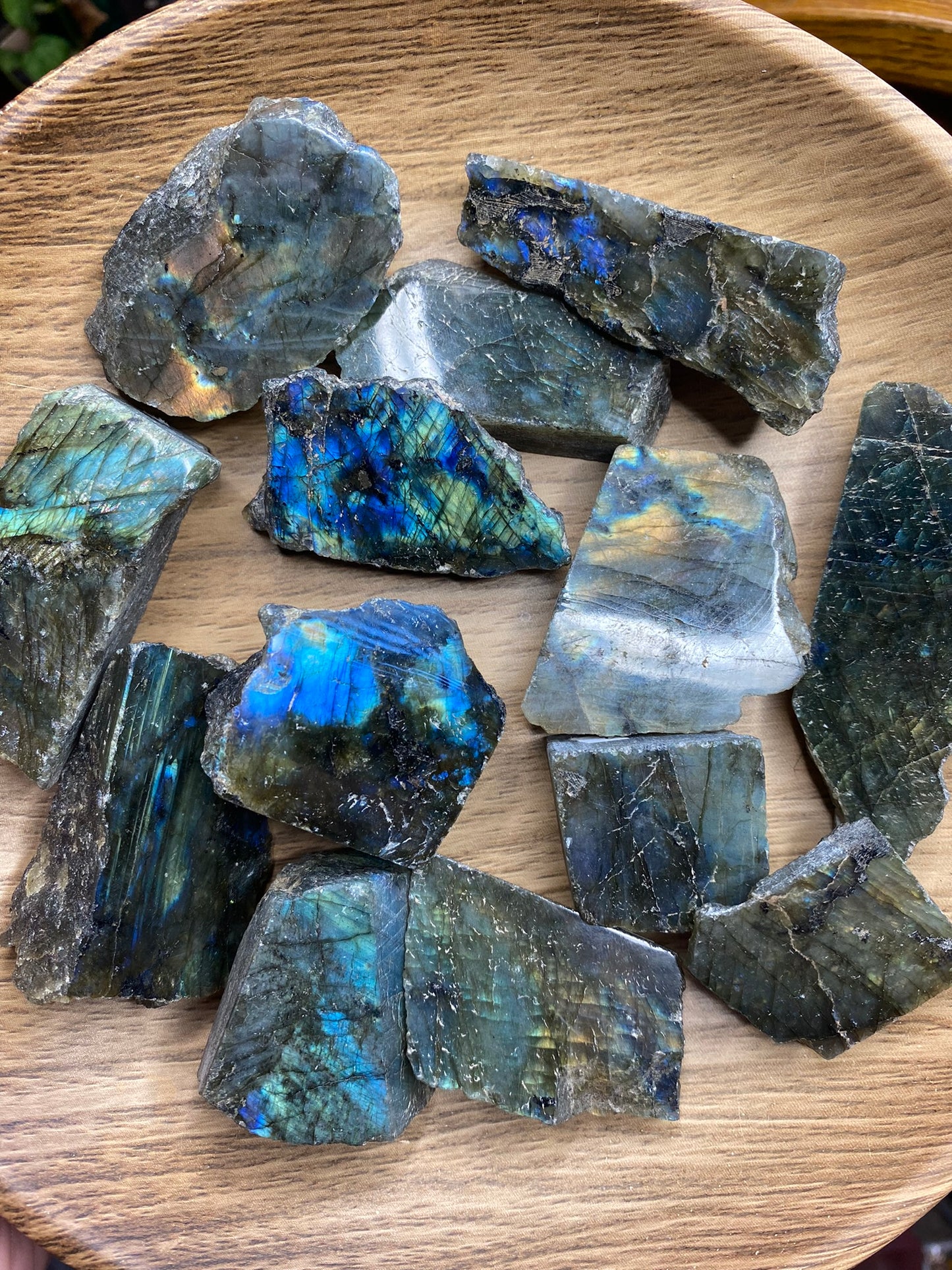 wooden bowl filled with labradorite