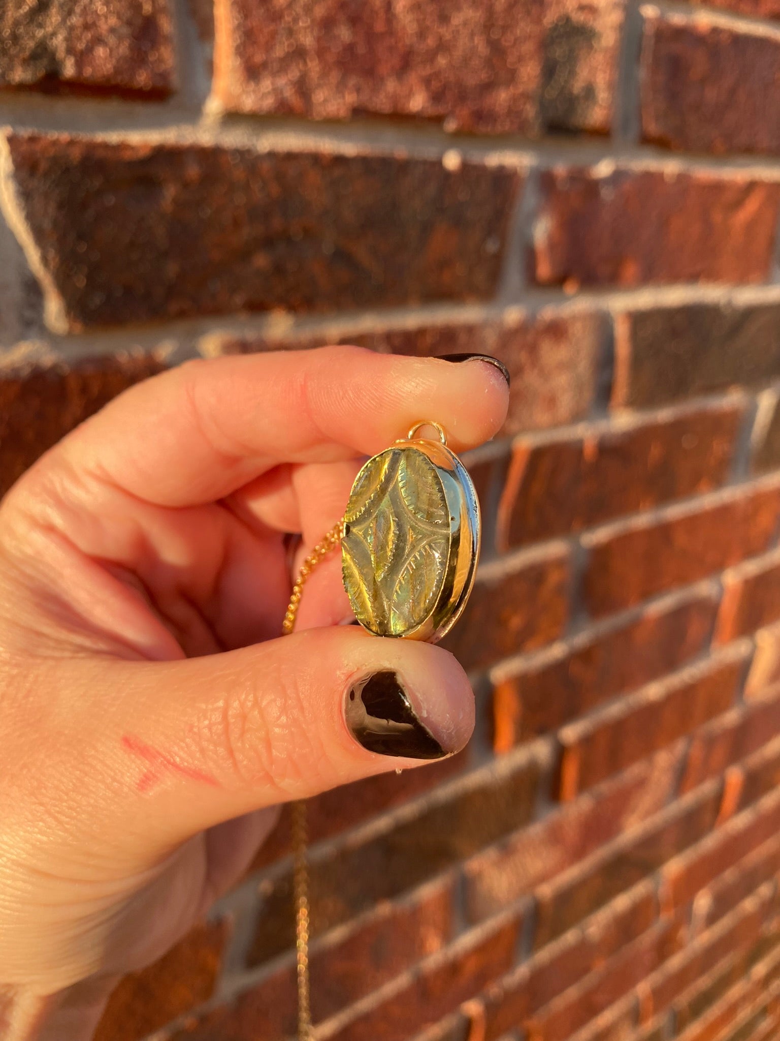 side view of carved labradorite pendant