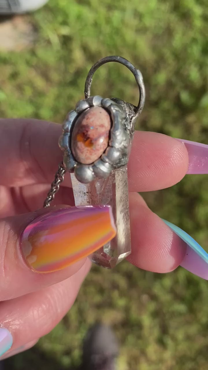 short video showing the flash on the mexican fire opal on a quartz pendant